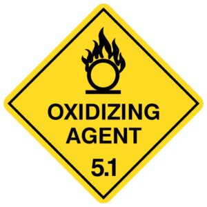 A diamond-shaped hazard sign with a yellow background, featuring a symbol of a flame over a circle, indicating 'OXIDIZING AGENT' and the number '5.1'. This sign denotes Class 5.1 dangerous goods under the Australian Dangerous Goods Code, representing oxidizing substances that can contribute to the combustion of other materials, necessitating careful handling and storage to prevent fire or explosion.