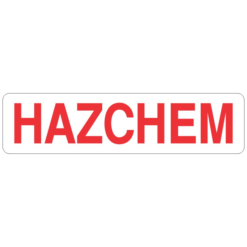 A rectangular sign with the word 'HAZCHEM' written in bold red capital letters on a white background, indicating the presence of hazardous chemicals.