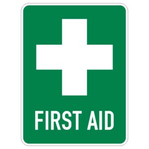 A green sign featuring a white cross above the words FIRST AID in white letters.