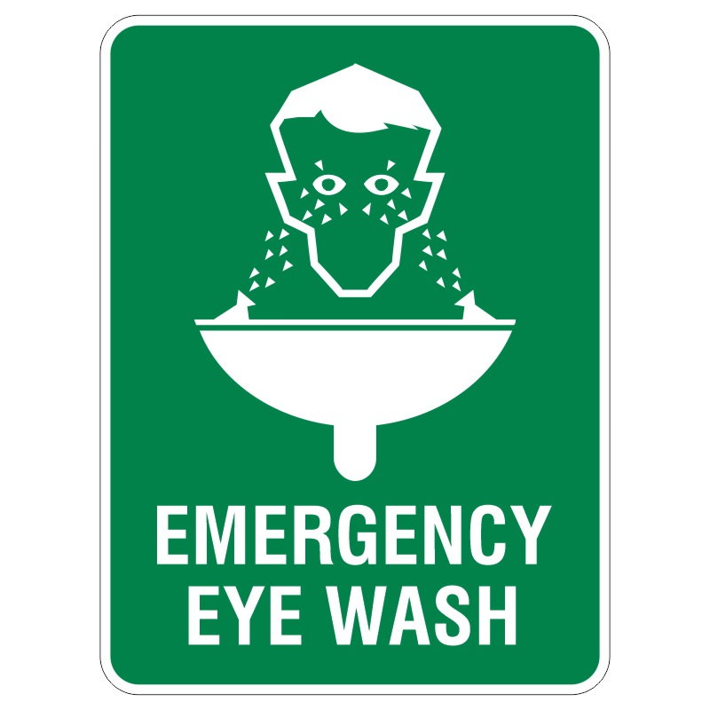A green sign depicting an emergency eye wash station with a graphic of a person tilting their head back, water spraying into their eyes from two nozzles over a sink, with the words EMERGENCY EYE WASH at the bottom.