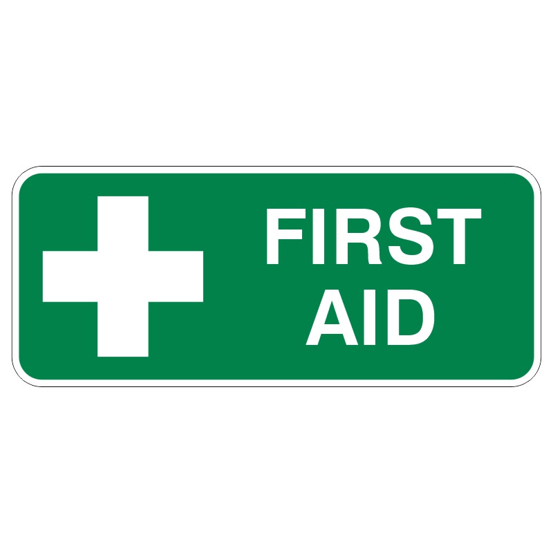 A green sign with a white cross and the words FIRST AID in bold white lettering, indicating the location of a first aid station or services.