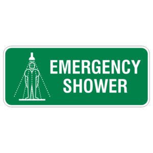 A green sign displaying the words EMERGENCY SHOWER with a graphic illustration of a person standing under a showerhead, signifying the location of an emergency shower.