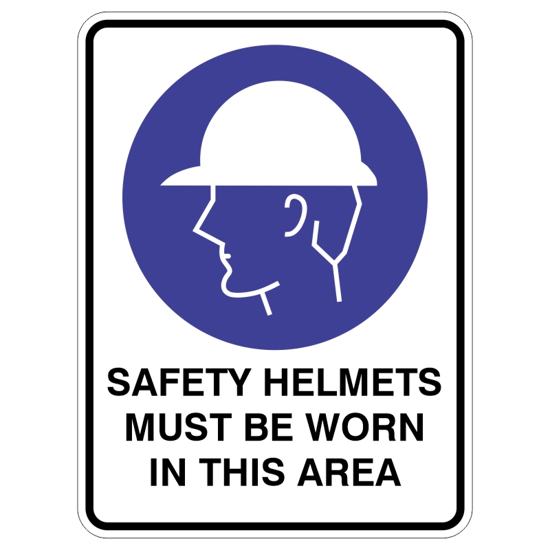 A safety sign showing a profile of a person wearing a hard hat, accompanied by the text SAFETY HELMETS MUST BE WORN IN THIS AREA at the bottom.
