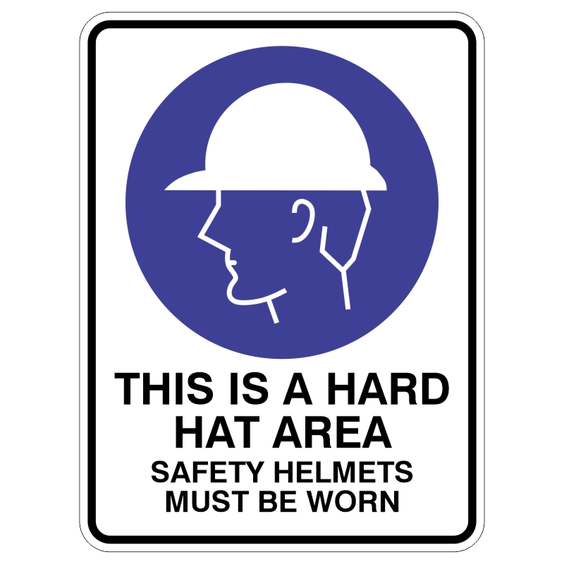 Sign indicating a hard hat area with a graphic of a person wearing a hard hat, including the text THIS IS A HARD HAT AREA and SAFETY HELMETS MUST BE WORN.