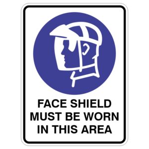 A sign featuring a blue circle with a white outline of a person's head wearing a face shield, accompanied by the text FACE SHIELD MUST BE WORN IN THIS AREA in bold black letters underneath.