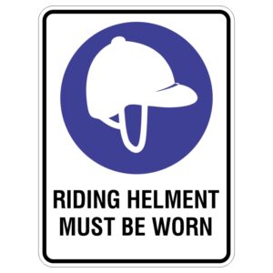 A safety sign featuring a silhouette of a riding helmet in white against a blue circular background, with the text RIDING HELMET MUST BE WORN in bold black letters beneath.