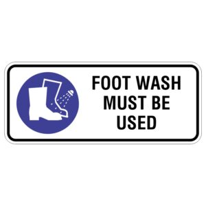 Sign with a blue circle and white illustration of a boot being sprayed with water, accompanied by the text FOOT WASH MUST BE USED.
