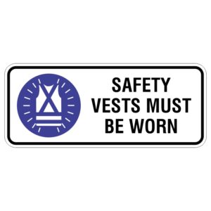 A rectangular sign with a blue background featuring an icon of a safety vest and the text SAFETY VESTS MUST BE WORN in bold black letters.