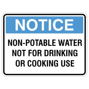 A warning sign with a blue header that reads NOTICE and the text NON-POTABLE WATER NOT FOR DRINKING OR COOKING USE in bold black letters.