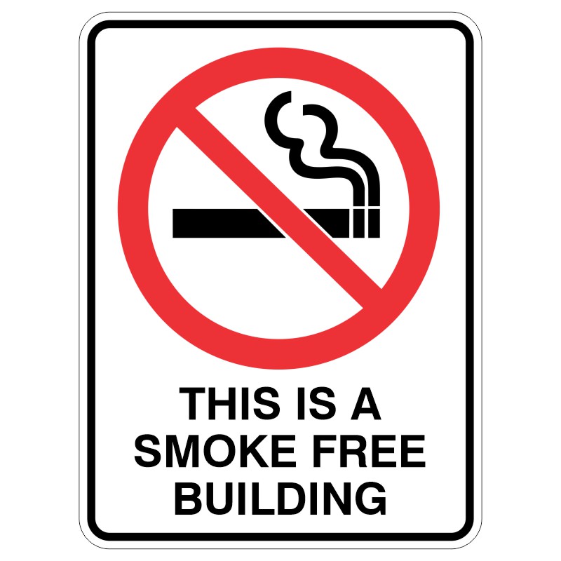 A sign featuring a red circle with a diagonal line over a black cigarette icon and smoke, accompanied by the text THIS IS A SMOKE FREE BUILDING below.