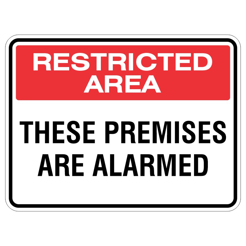 A sign displaying the text 'RESTRICTED AREA' in red on top and 'THESE PREMISES ARE ALARMED' in black below, indicating limited access and security measures.