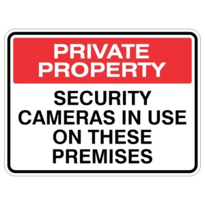 A sign indicating private property, stating that security cameras are in use on the premises, featuring a red background with white text.