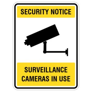 A yellow security notice sign featuring a black silhouette of a surveillance camera, with the text 'SURVEILLANCE CAMERAS IN USE' below the camera image.