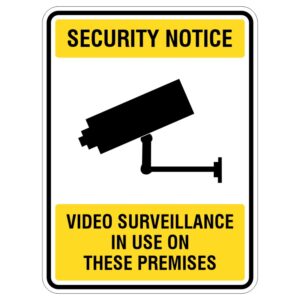 A security notice sign featuring a silhouette of a surveillance camera, with the text 'SECURITY NOTICE' at the top and 'VIDEO SURVEILLANCE IN USE ON THESE PREMISES' at the bottom, all enclosed in a yellow and black border.