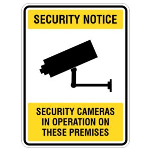 A security notice sign featuring a black silhouette of a security camera on a white background with yellow borders, stating 'SECURITY NOTICE' at the top and 'SECURITY CAMERAS IN OPERATION ON THESE PREMISES' at the bottom.