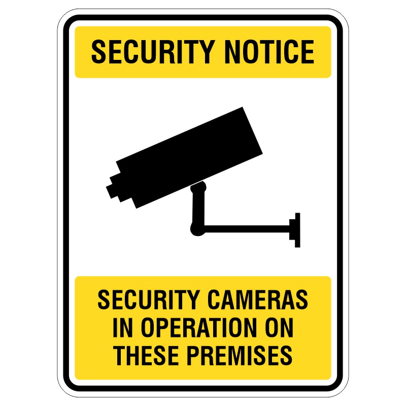 A security notice sign featuring a black silhouette of a security camera on a white background with yellow borders, stating 'SECURITY NOTICE' at the top and 'SECURITY CAMERAS IN OPERATION ON THESE PREMISES' at the bottom.