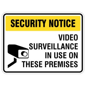 A security notice sign featuring bold text that reads 'SECURITY NOTICE' at the top, and 'VIDEO SURVEILLANCE IN USE ON THESE PREMISES' below. The sign includes an image of a surveillance camera.