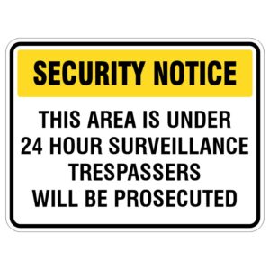 A rectangular security notice sign with a yellow header that reads 'SECURITY NOTICE'. Below, it states 'THIS AREA IS UNDER 24 HOUR SURVEILLANCE' and 'TRESPASSERS WILL BE PROSECUTED' in bold black text.