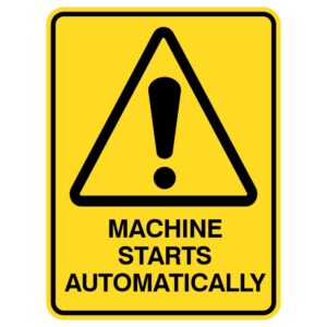 A yellow warning sign featuring a black triangle with an exclamation mark inside, stating 'MACHINE STARTS AUTOMATICALLY' in bold black text below.